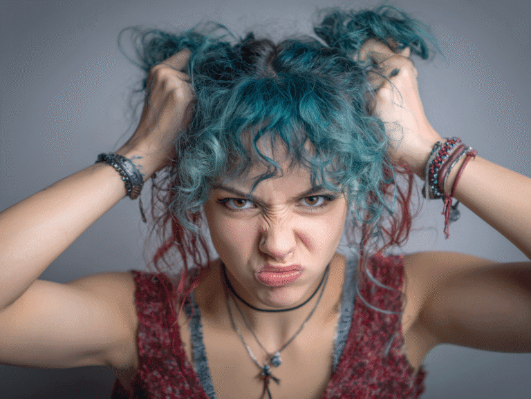Angry alt woman pulling her hair in frustration, symbolizing emotional tension and the need for control and calibration in social dynamics